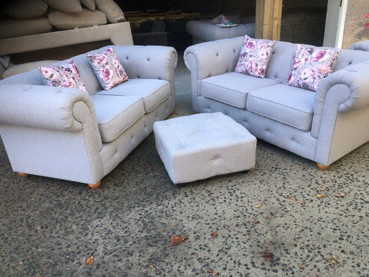 Pair of new Chesterfield style 2 seater sofas and footstool