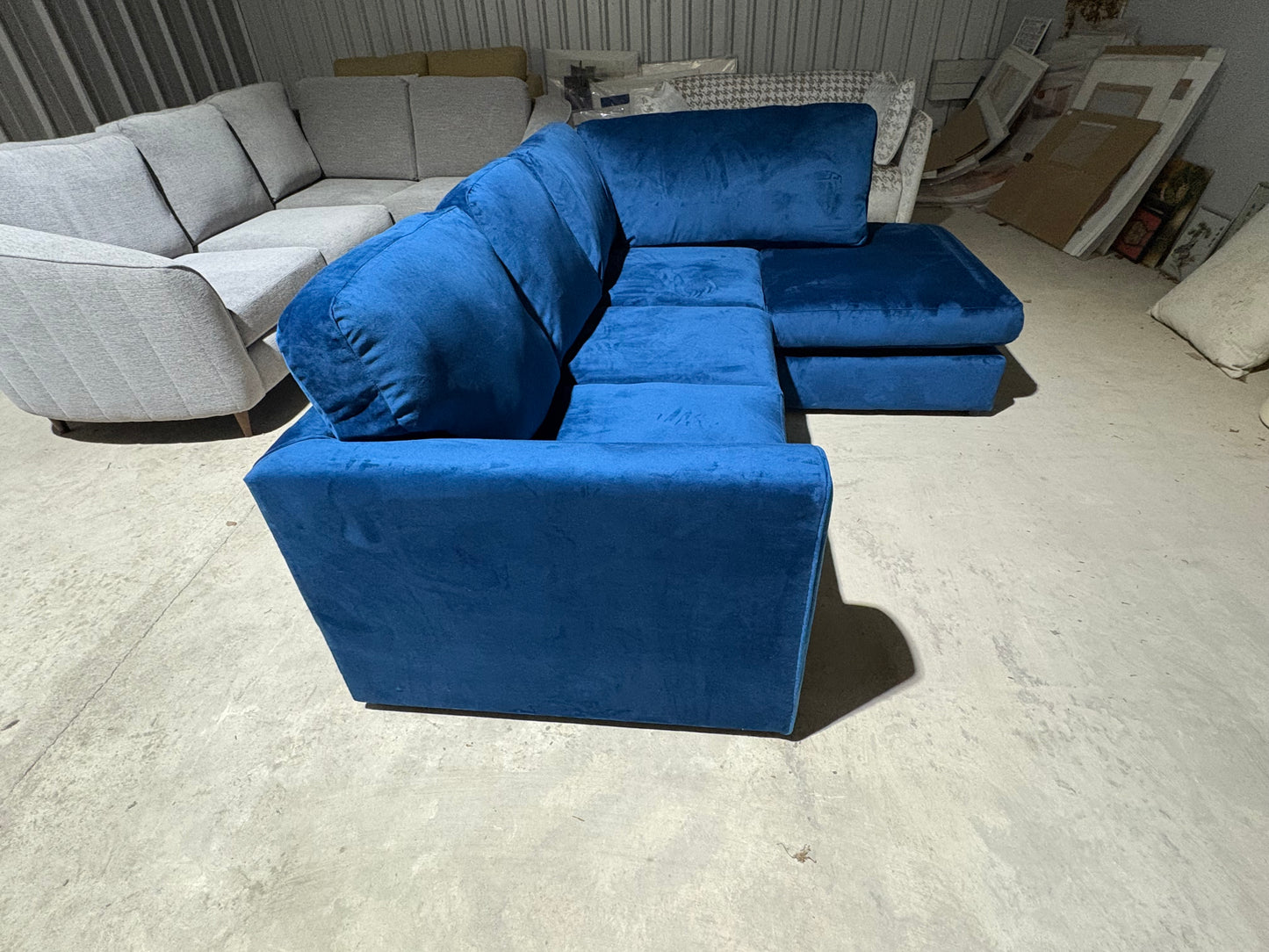 Corner sofa in striking blue velvet