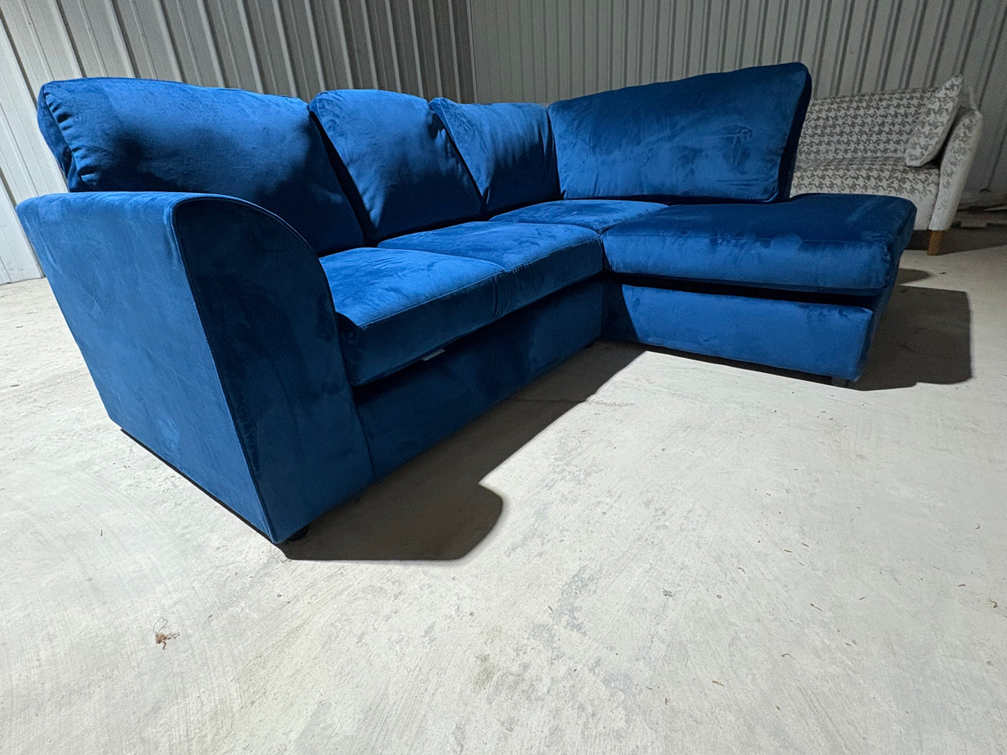 Corner sofa in striking blue velvet