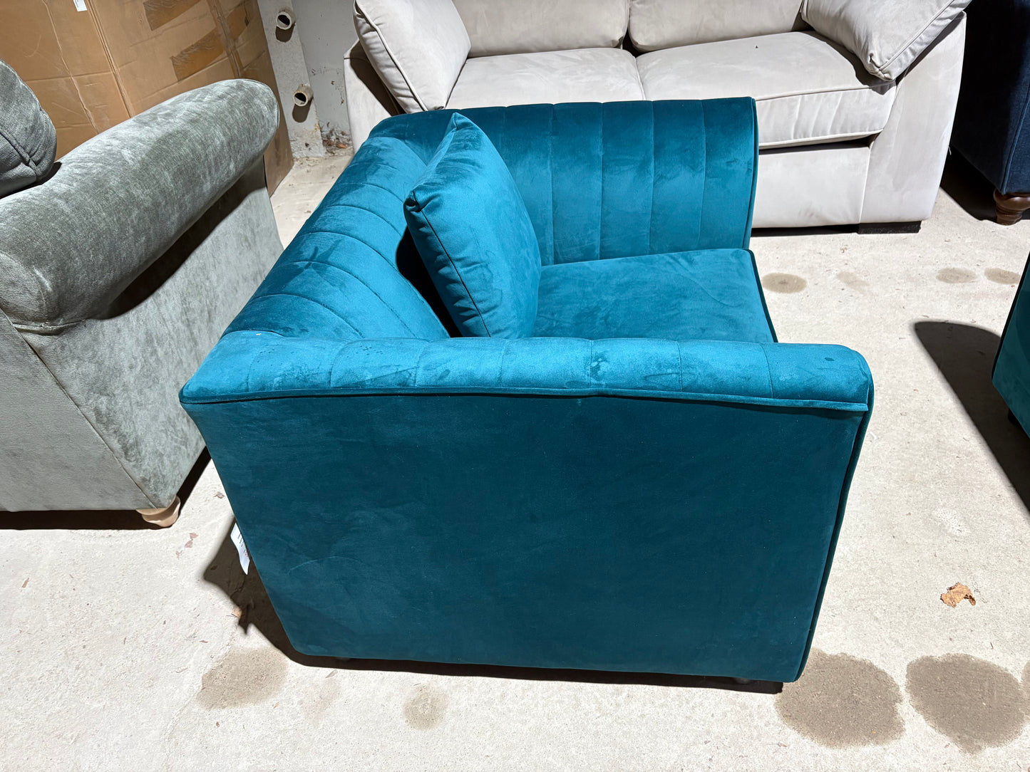 Teal velvet cuddler armchair